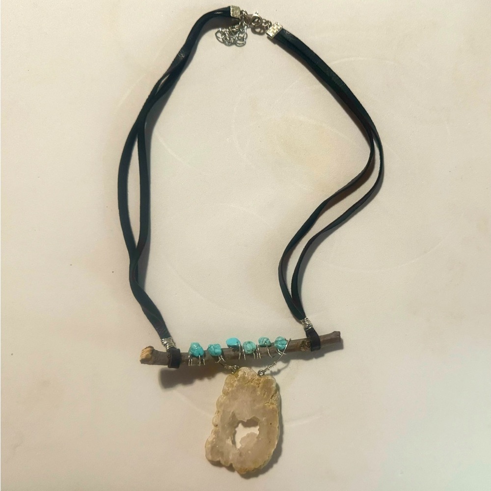Handmade natural necklace with white and turquoise rocks.